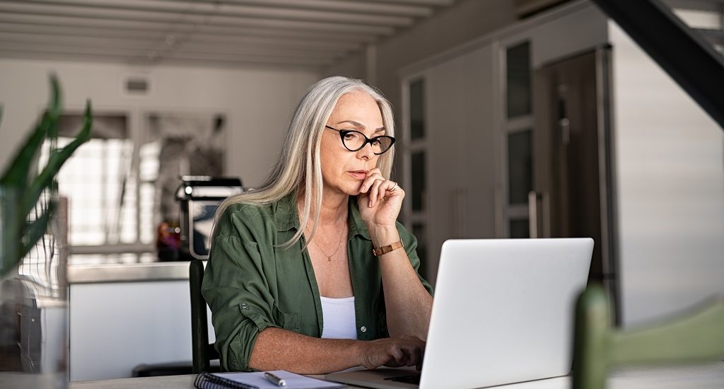 Woman uses laptop